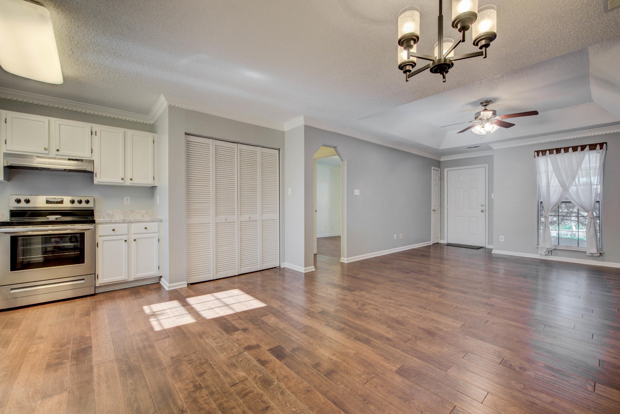 4356 Walnut Ridge Lane Knoxville, TN 37921 - Photo 7 of 23 a view of a kitchen with a stove cabinets and wooden floor