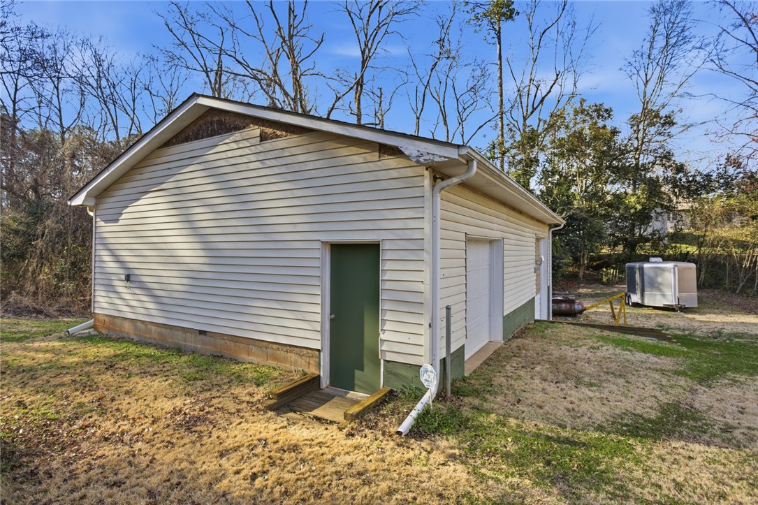 1005 Pinecroft Drive Anderson, SC 29621 - Photo 14 of 50 This functional outbuilding features practical siding and multiple access points for convenience.