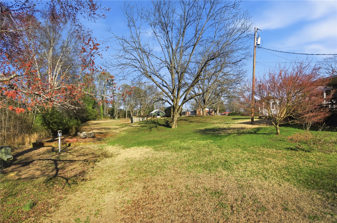 1005 Pinecroft Drive Anderson, SC 29621 - Photo 16 of 50 Expansive green space offers a serene outdoor setting, perfect for relaxation or entertaining.