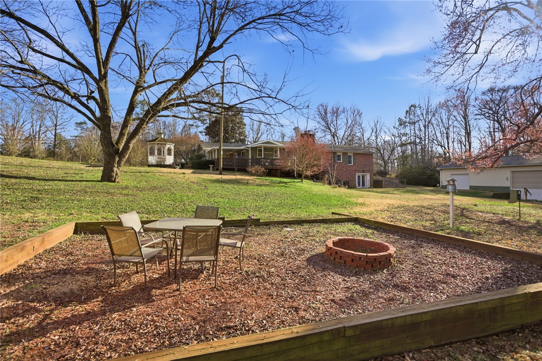 1005 Pinecroft Drive Anderson, SC 29621 - Photo 17 of 50 This expansive yard offers ample space for outdoor enjoyment and features a charming gazebo.