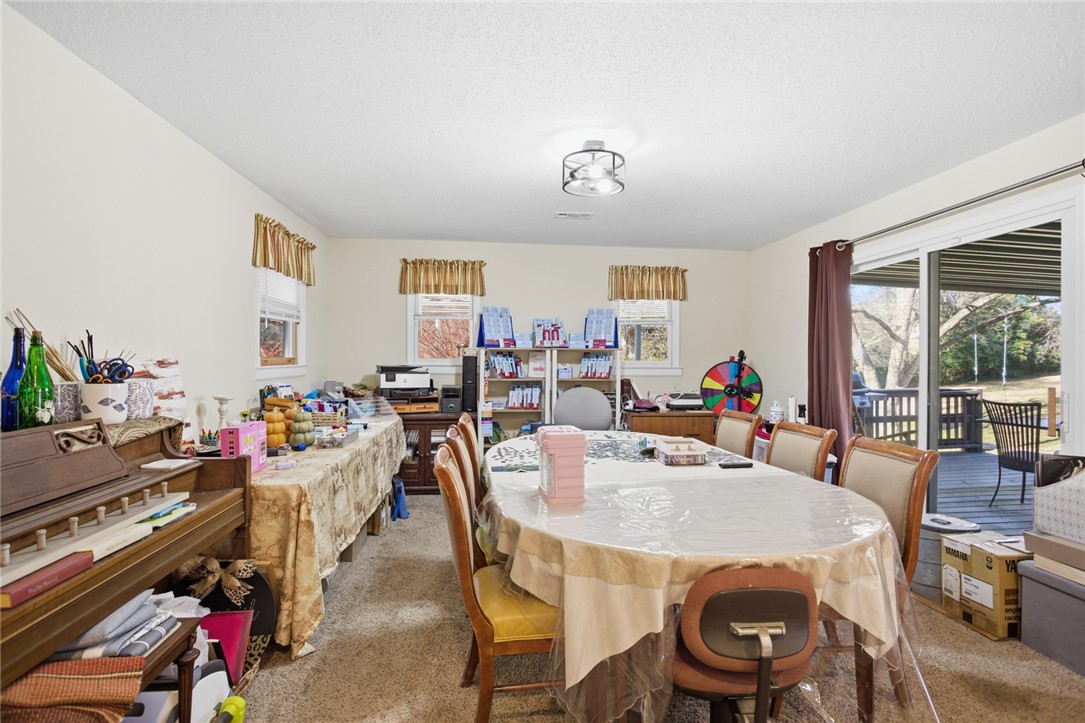 1005 Pinecroft Drive Anderson, SC 29621 - Photo 29 of 50 This versatile room offers ample space for dining or creative pursuits with convenient outdoor access.