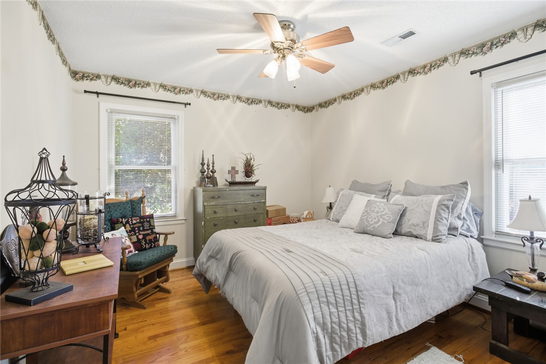1005 Pinecroft Drive Anderson, SC 29621 - Photo 37 of 50 This inviting bedroom features rich hardwood flooring and abundant natural light through multiple windows.