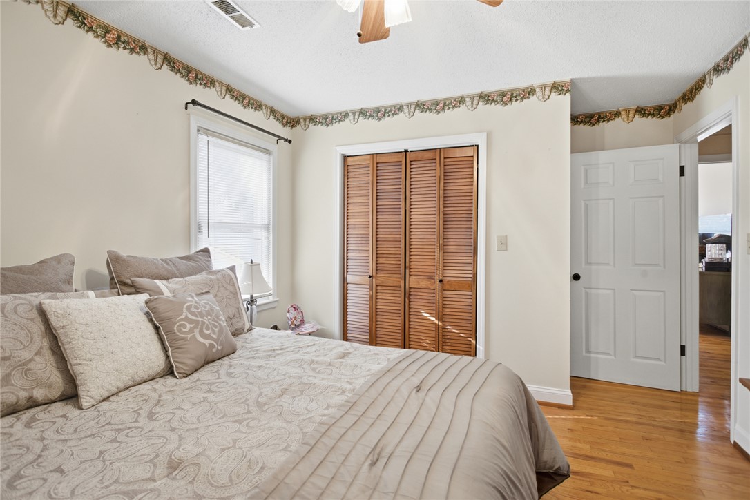 1005 Pinecroft Drive Anderson, SC 29621 - Photo 38 of 50 This cozy room features hardwood floors, a ceiling fan, and a convenient closet.