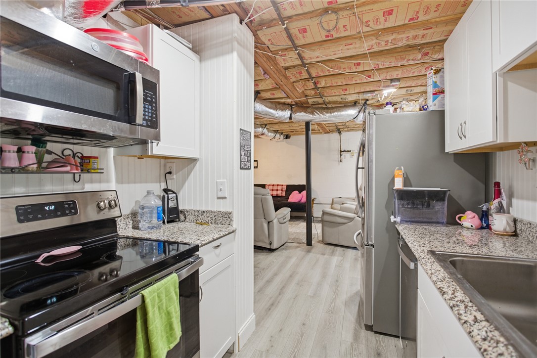 1005 Pinecroft Drive Anderson, SC 29621 - Photo 47 of 50 This cozy space features a well-equipped kitchen area leading into a comfortable living space.