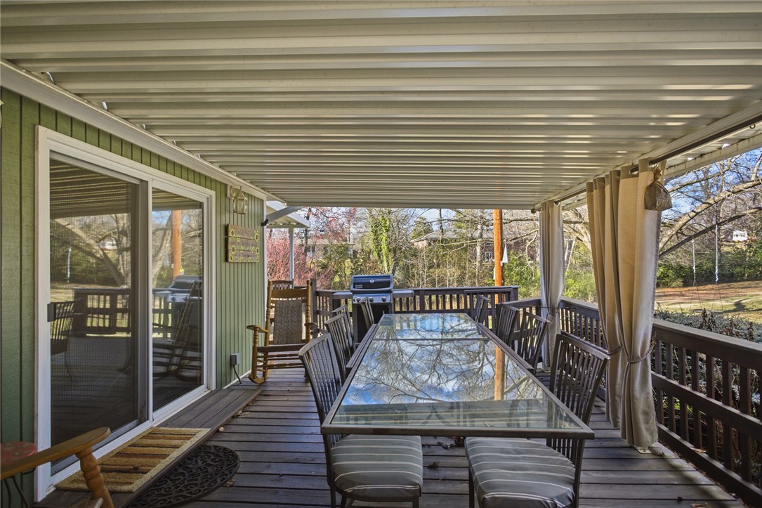 1005 Pinecroft Drive Anderson, SC 29621 - Photo 9 of 50 Enjoy outdoor gatherings on this spacious deck, perfect for relaxation and entertainment.