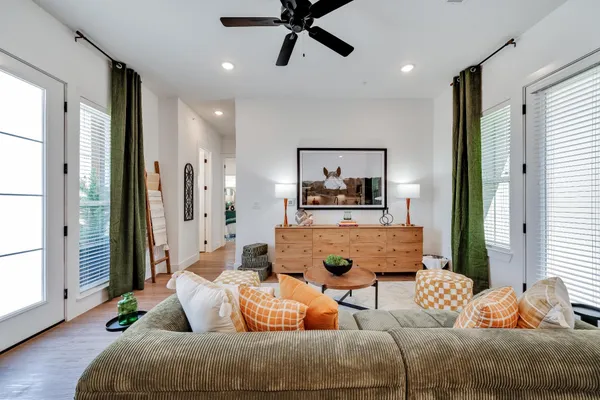 a living room with furniture and a window