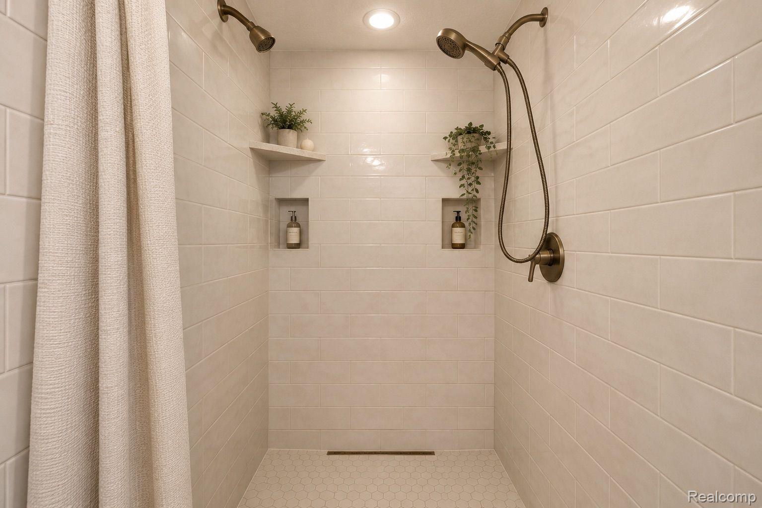 76565 McFadden Road Armada, MI 48005 - Photo 30 of 95 Dual shower heads with bronze finishes, tiled walls, recessed niches, corner shelving, and hexagonal floor tiling