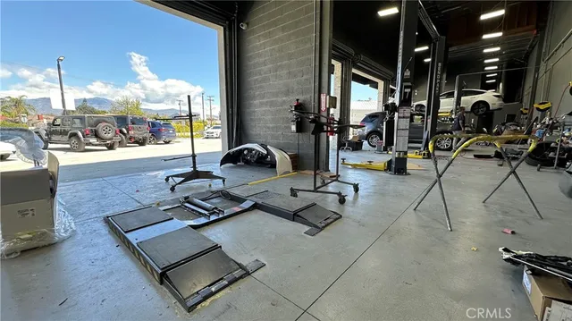 a view of a livingroom with furniture and flat screen tv