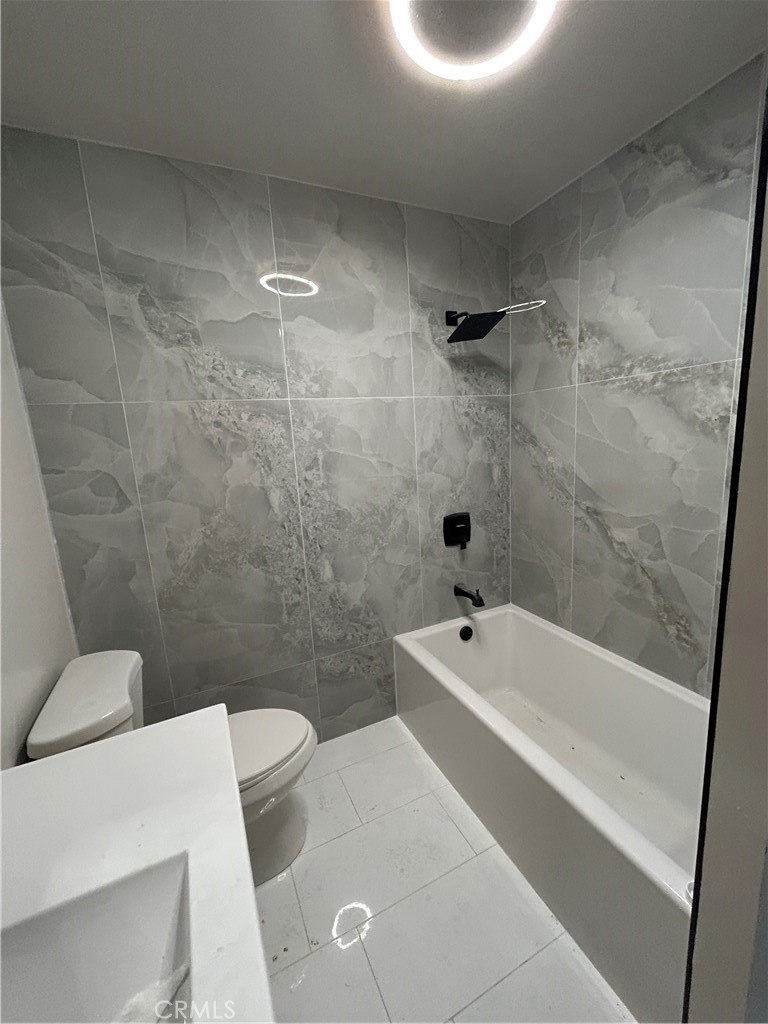 3375 Baltic Avenue Long Beach, CA 90810 - Photo 12 of 24 a bathroom with a sink a toilet and bathtub