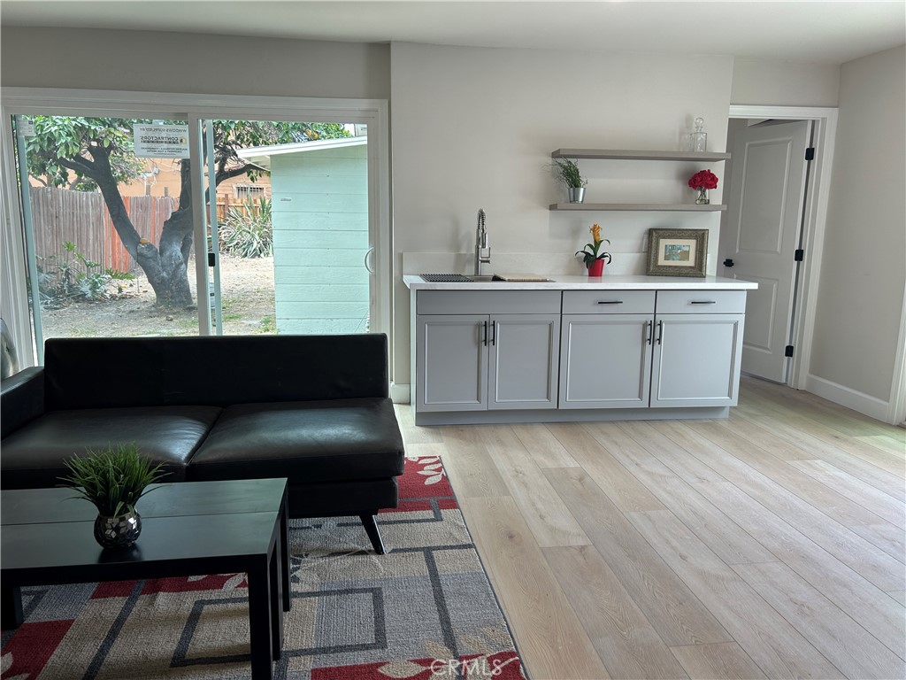 3375 Baltic Avenue Long Beach, CA 90810 - Photo 14 of 24 a room with a chair and cabinets