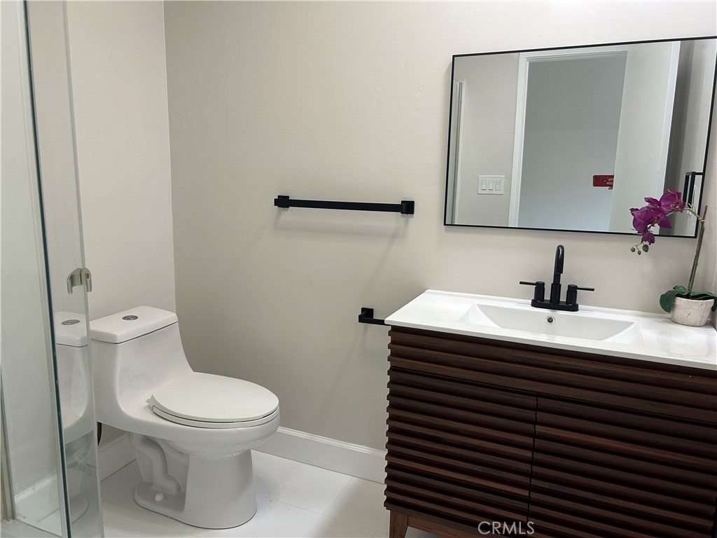 3375 Baltic Avenue Long Beach, CA 90810 - Photo 18 of 24 a bathroom with a sink and a toilet