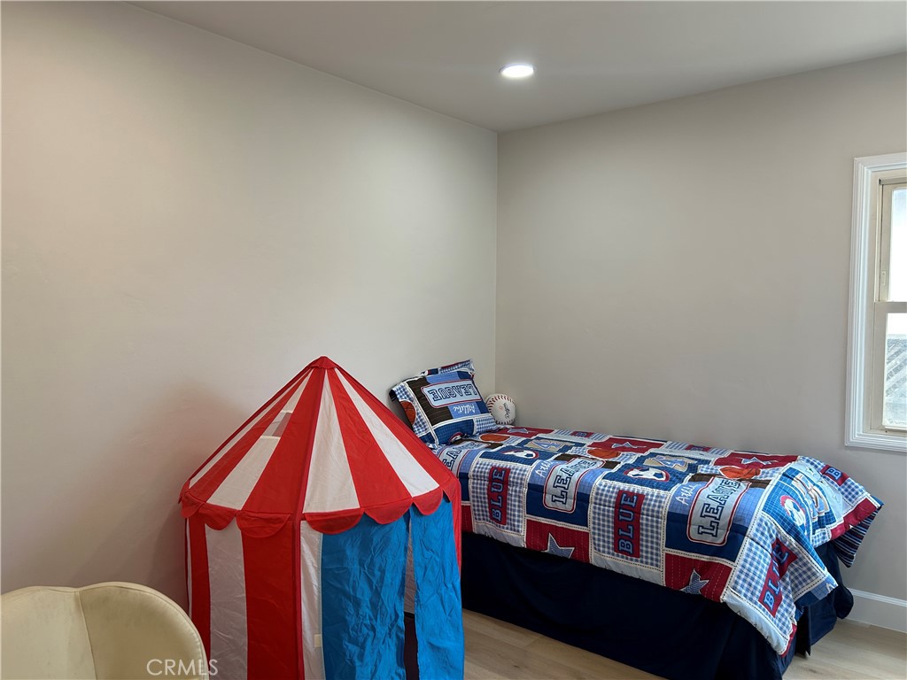 3375 Baltic Avenue Long Beach, CA 90810 - Photo 20 of 24 a bedroom with a bed and a dresser in it
