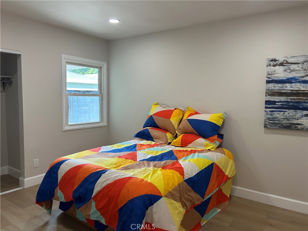 3375 Baltic Avenue Long Beach, CA 90810 - Photo 21 of 24 a bedroom with a bed and a window