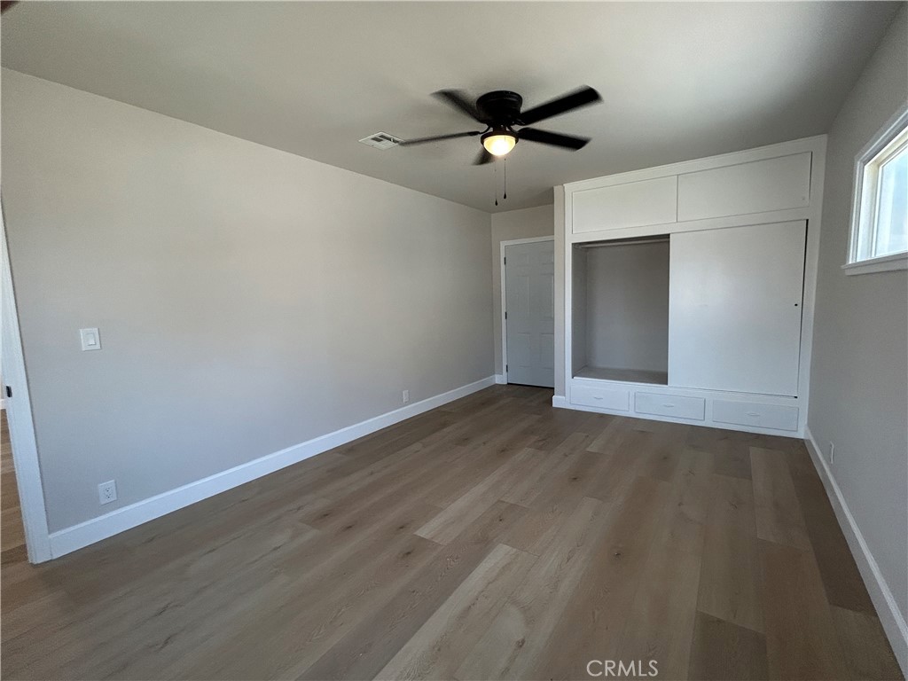3375 Baltic Avenue Long Beach, CA 90810 - Photo 24 of 24 an empty room with wooden floor and windows