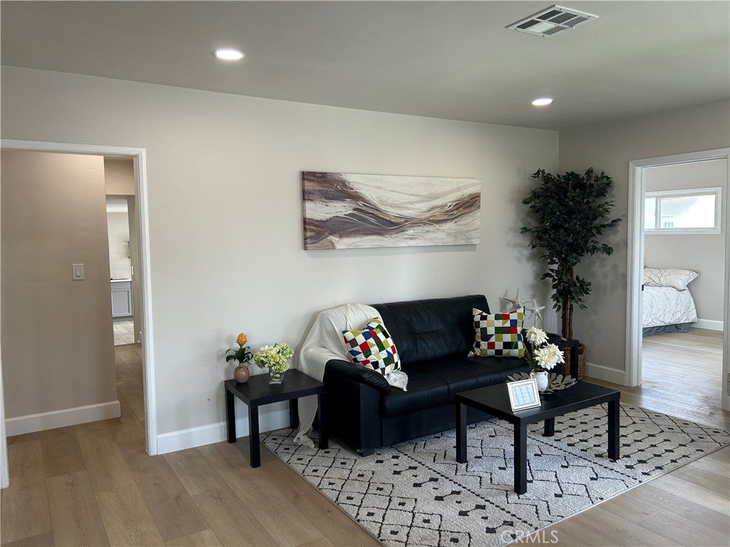 3375 Baltic Avenue Long Beach, CA 90810 - Photo 3 of 24 a living room with furniture and wooden floor