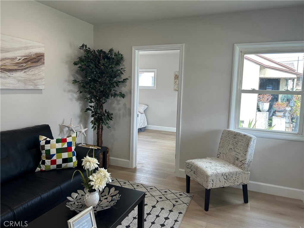 3375 Baltic Avenue Long Beach, CA 90810 - Photo 4 of 24 a living room with furniture and a potted plant
