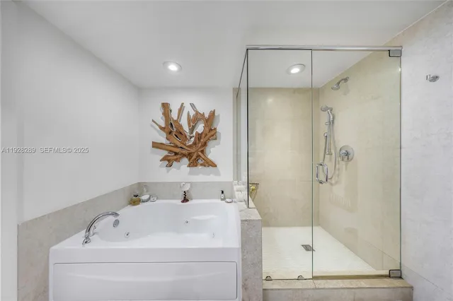 a bathroom with a shower and a sink