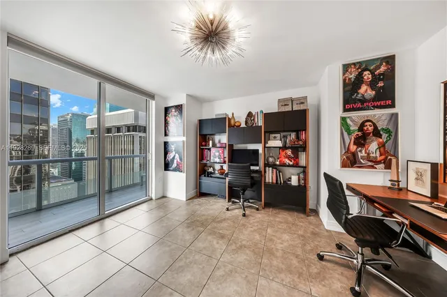 a view of a workspace with furniture and closet