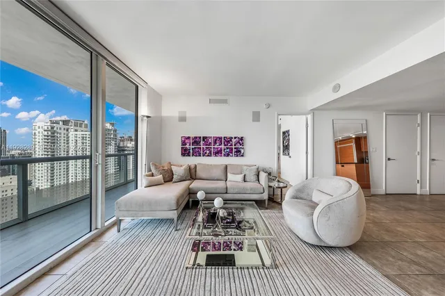 a bedroom with furniture and a wooden floor
