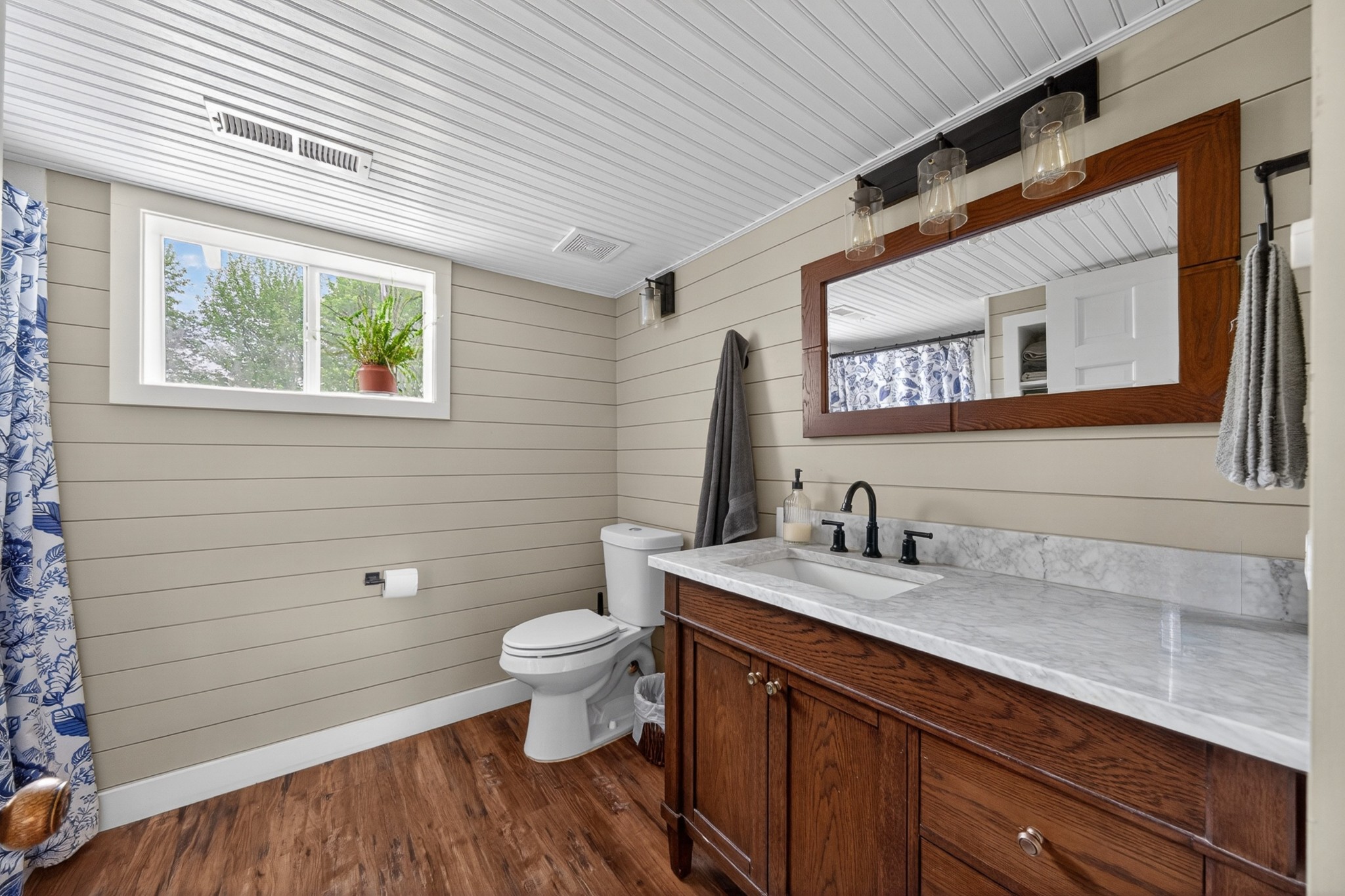 7400 Franks Ferry Road Walling, TN 38587 - Photo 24 of 55 a bathroom with a granite countertop sink a toilet and a mirror