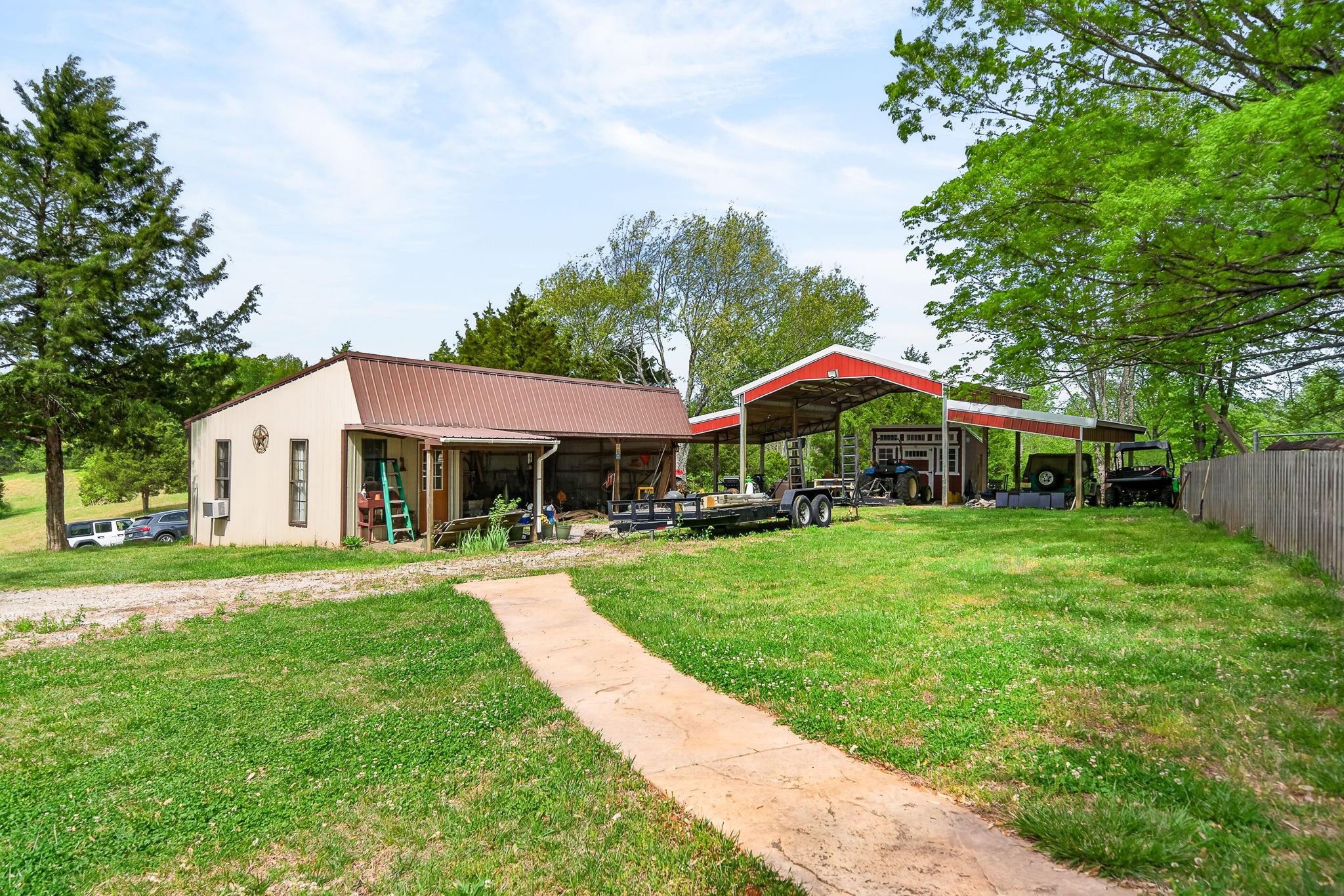 7400 Franks Ferry Road Walling, TN 38587 - Photo 30 of 55 a front view of a house with a yard table and chairs