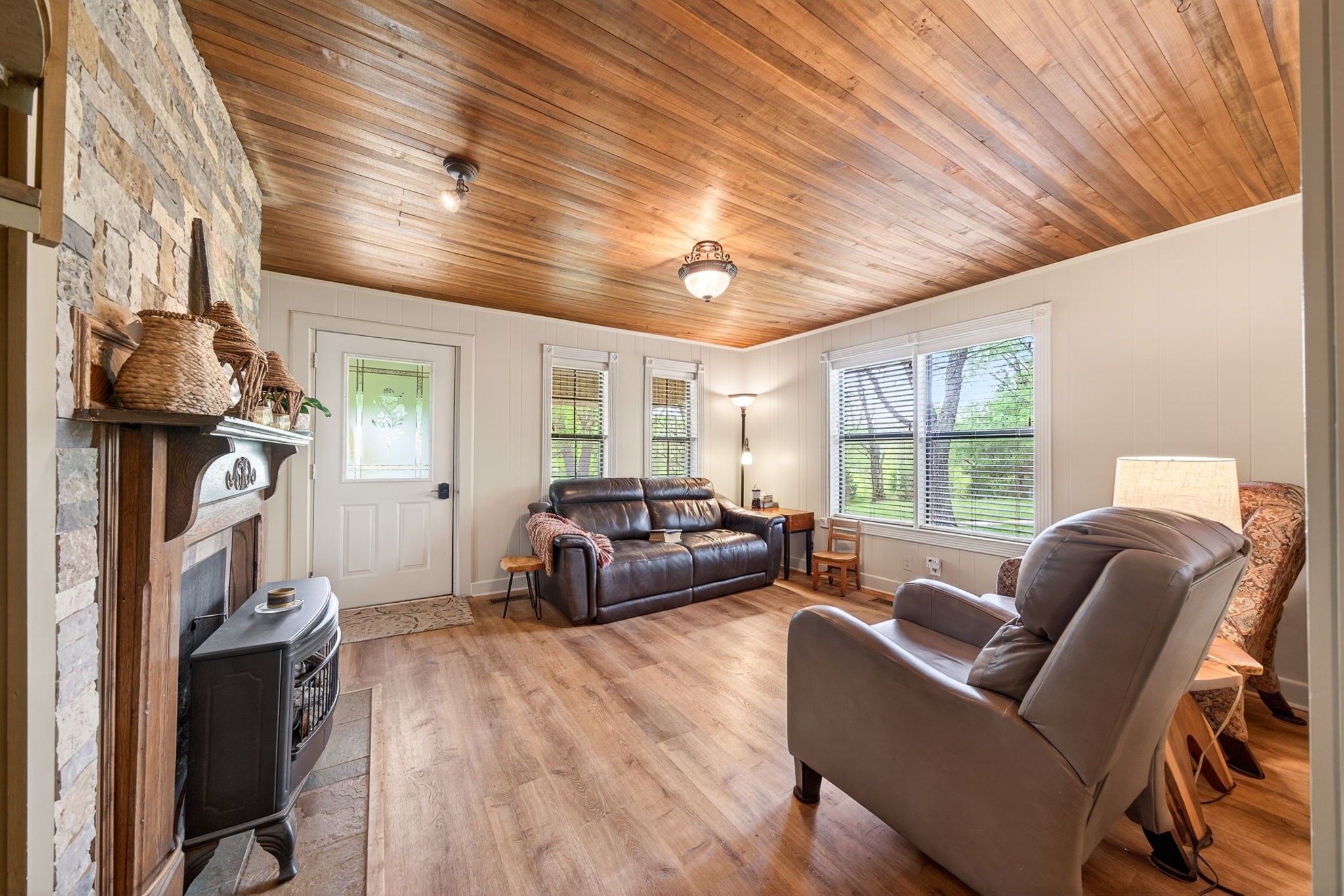 7400 Franks Ferry Road Walling, TN 38587 - Photo 9 of 55 a living room with furniture a fireplace and a large window