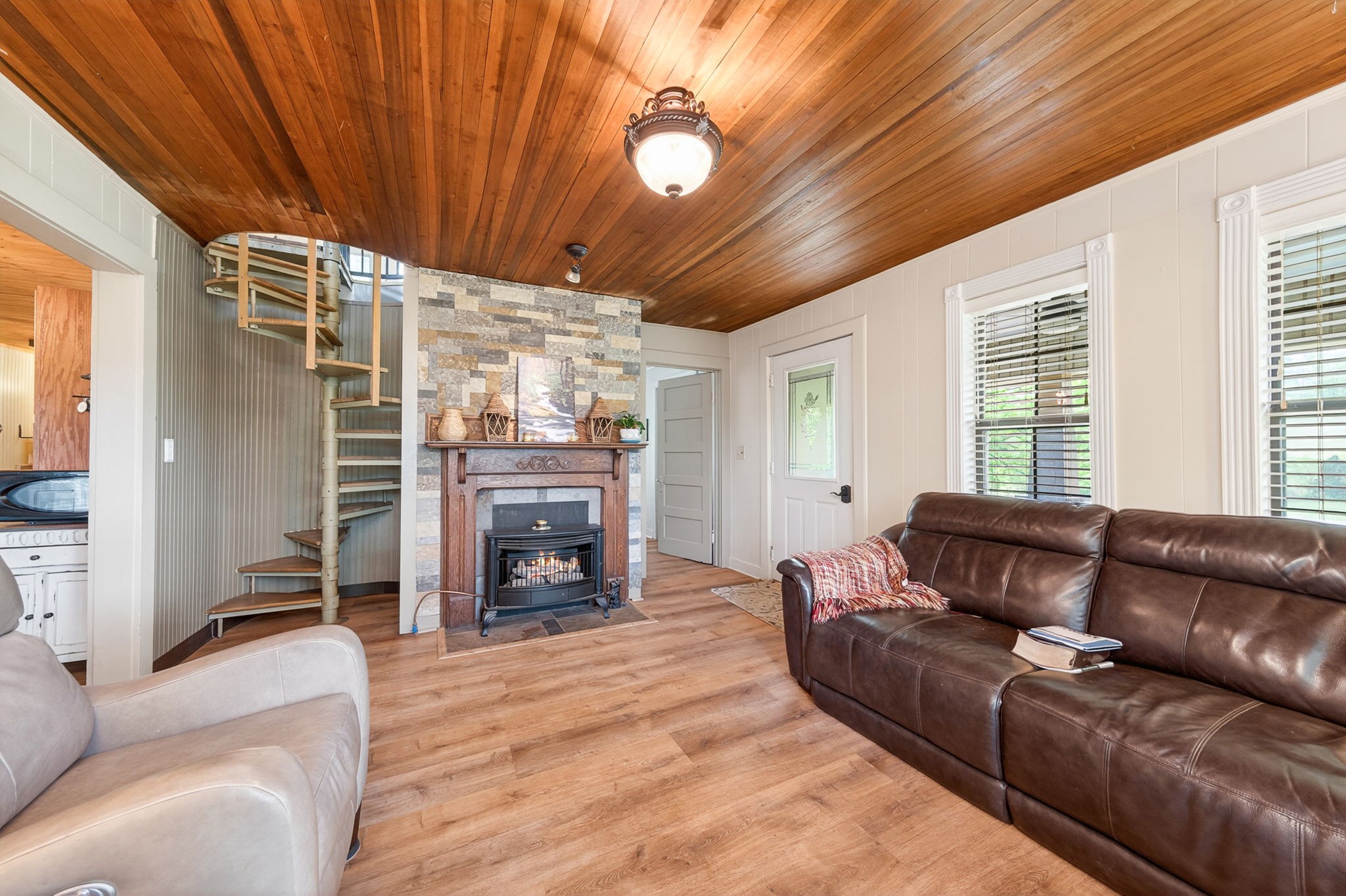 7400 Franks Ferry Road Walling, TN 38587 - Photo 10 of 55 a living room with furniture a fireplace and a flat tv screen