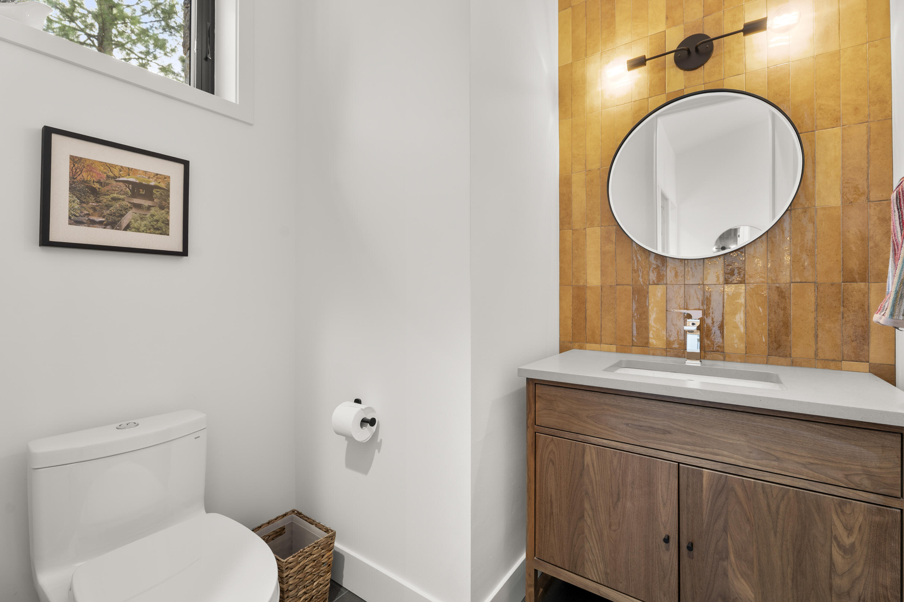 56670 Sunstone Loop, Unit LOT 141 Bend, OR 97707 - Photo 11 of 62 The home includes two half baths, each with its own design personality, modern lighting, and refined contemporary finishes.