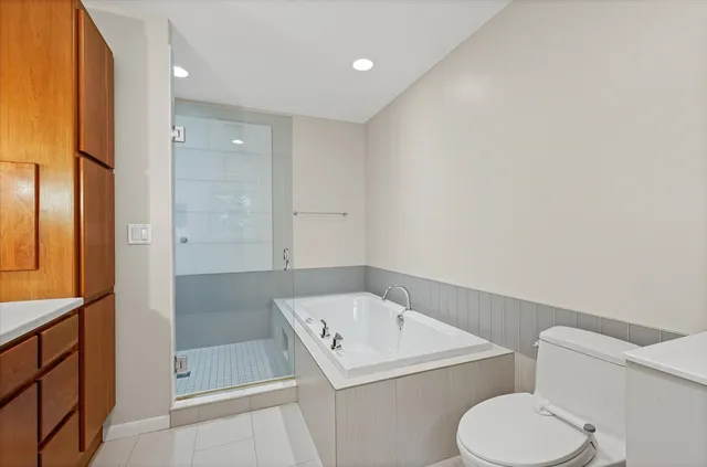 a bathroom with a toilet sink and shower