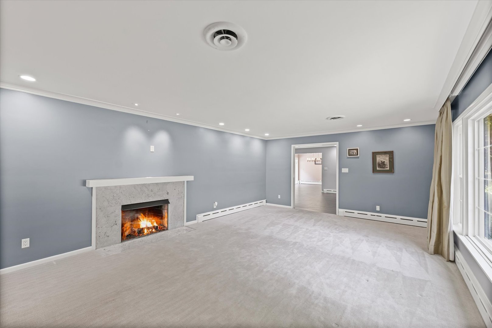 32 Greencroft Drive Champaign, IL 61821 - Photo 5 of 40 an empty room with a fireplace and a window