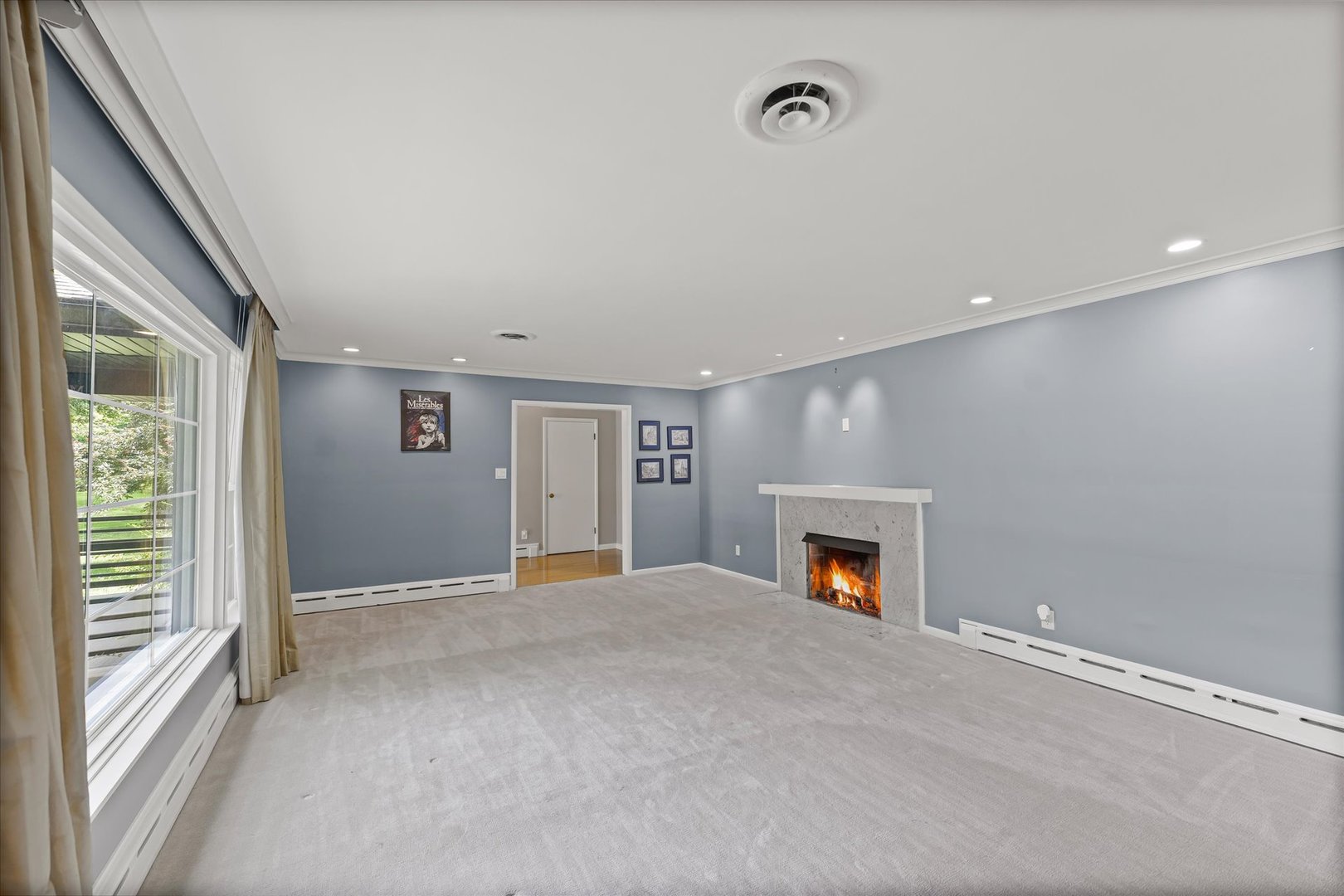 32 Greencroft Drive Champaign, IL 61821 - Photo 6 of 40 a view of an empty room with a fireplace and a window