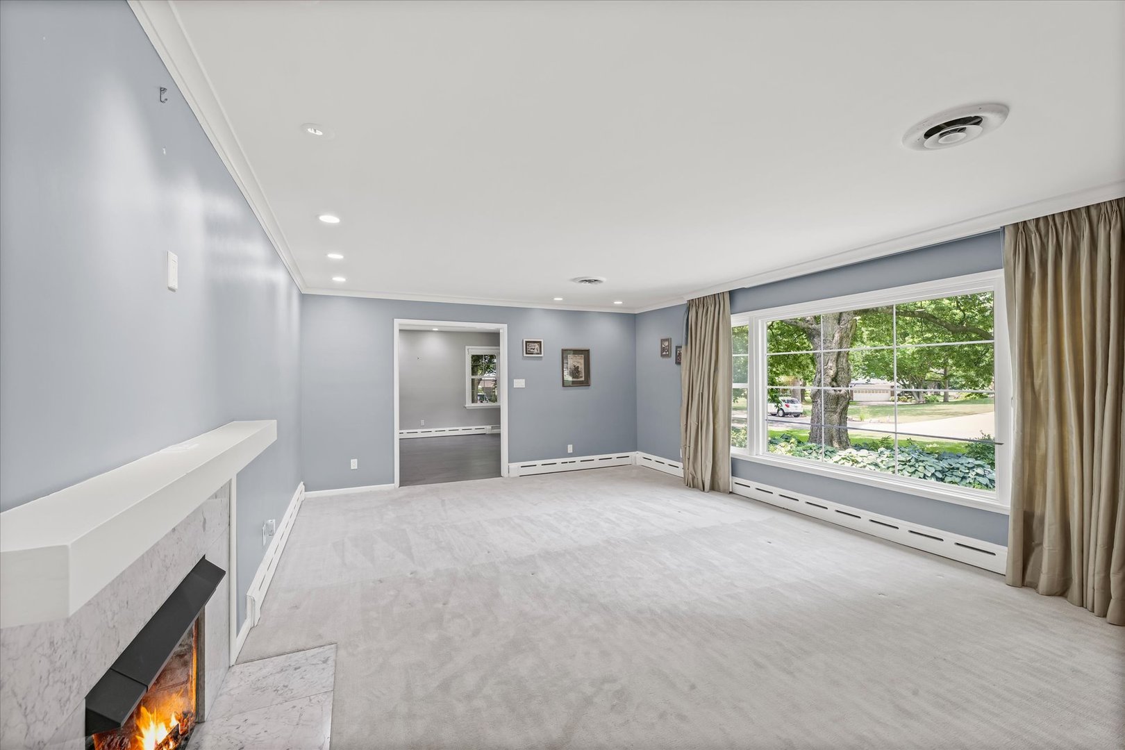 32 Greencroft Drive Champaign, IL 61821 - Photo 8 of 40 a view of an empty room with a window and a kitchen