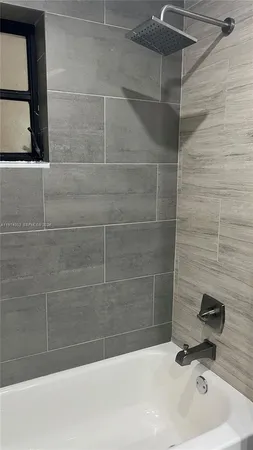 a bathroom with a sink and a shower