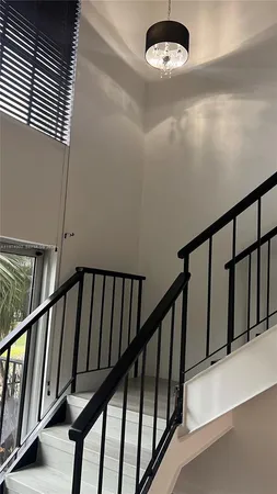 a view of staircase with wooden floor