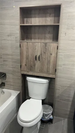 a bathroom with a toilet and a sink
