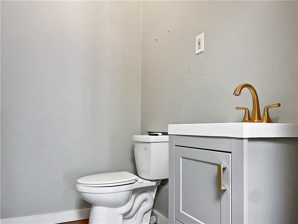 402 Loop, Unit LOOP Pittsburgh, PA 15215 - Photo 10 of 10 a bathroom with a sink toilet and a mirror