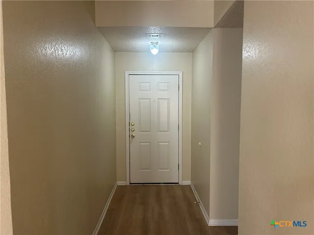 a view of hallway with closet