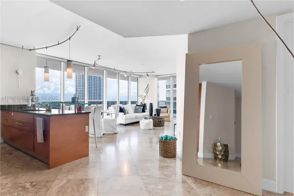 a kitchen with stainless steel appliances granite countertop a stove and a refrigerator