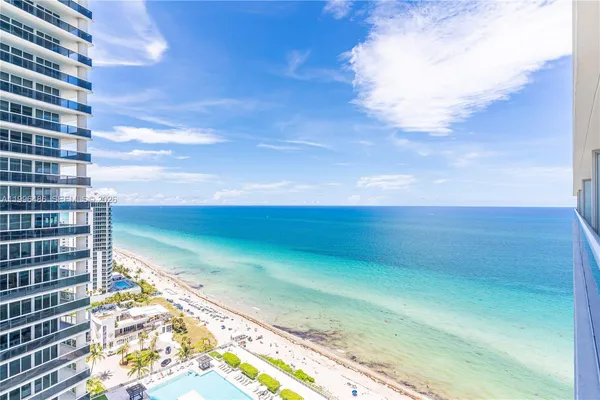 a view of building with an ocean