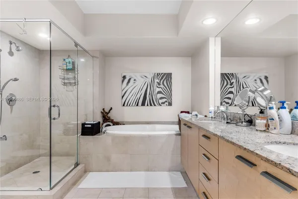 a bathroom with a toilet sink and shower