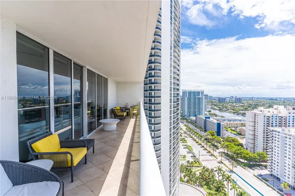 a view of a swimming pool with a lounge chairs