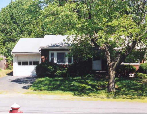 79 Cutter Hill Road Arlington, MA 02474 - Photo 1 of 1 a front view of a house with garden