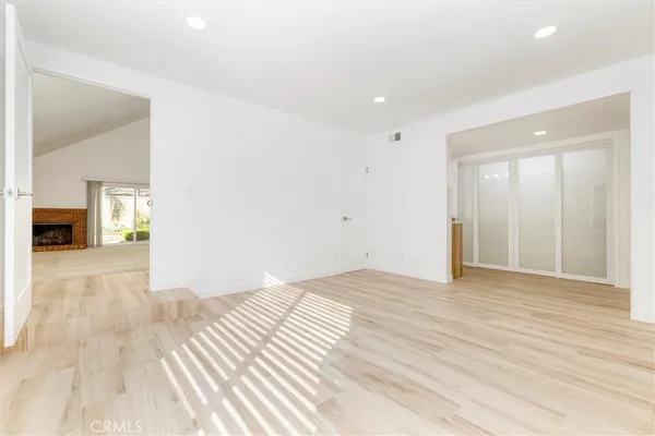 a bathroom with a granite countertop toilet a sink and shower