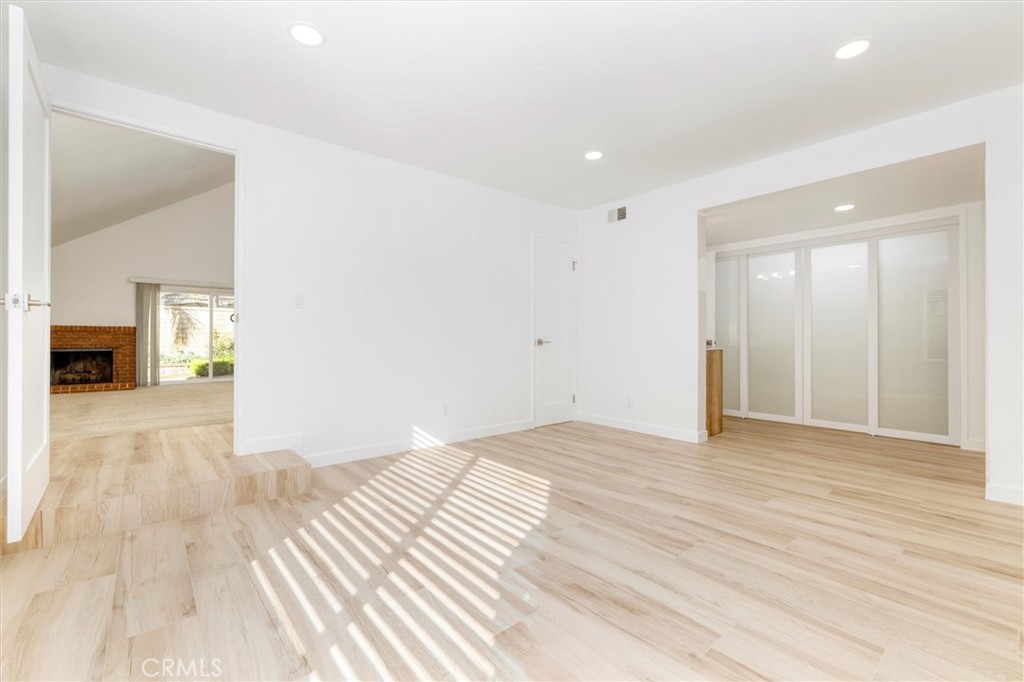 27139 Rio Prado Drive Valencia, CA 91354 - Photo 12 of 34 a view of a livingroom with wooden floor and a hallway