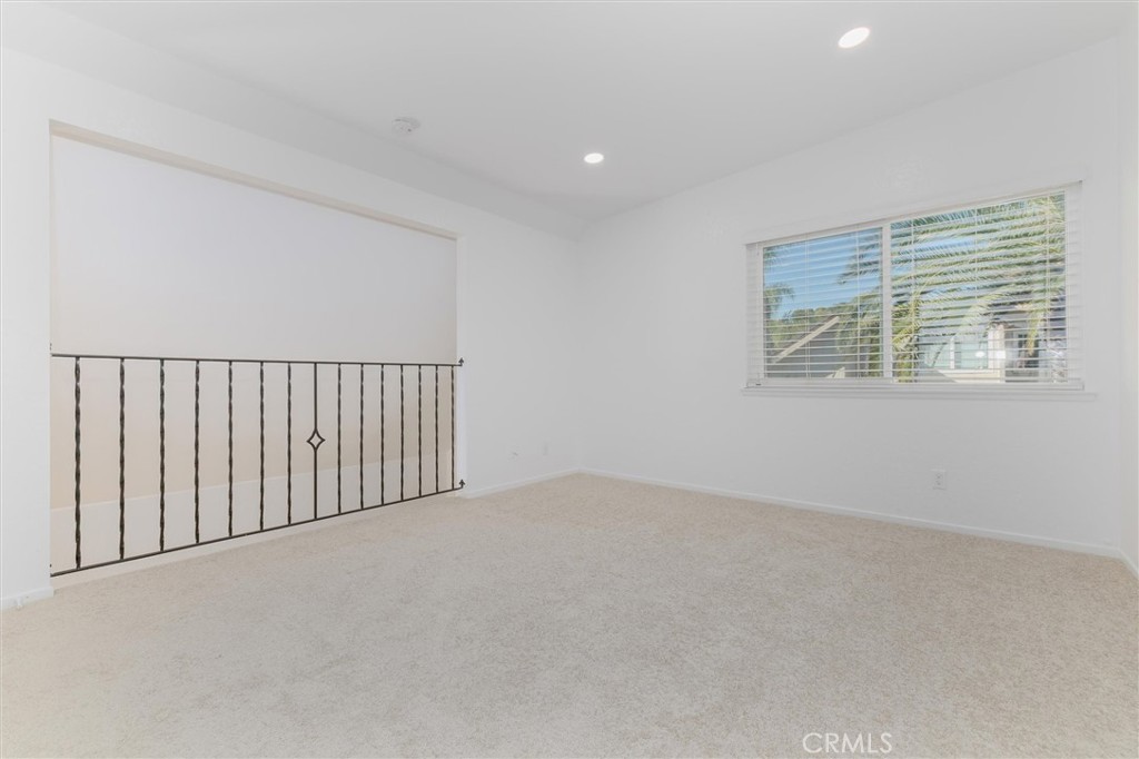 27139 Rio Prado Drive Valencia, CA 91354 - Photo 25 of 34 a view of an empty room with a window
