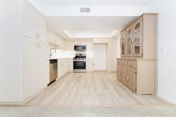 a view of a kitchen with a sink and a window