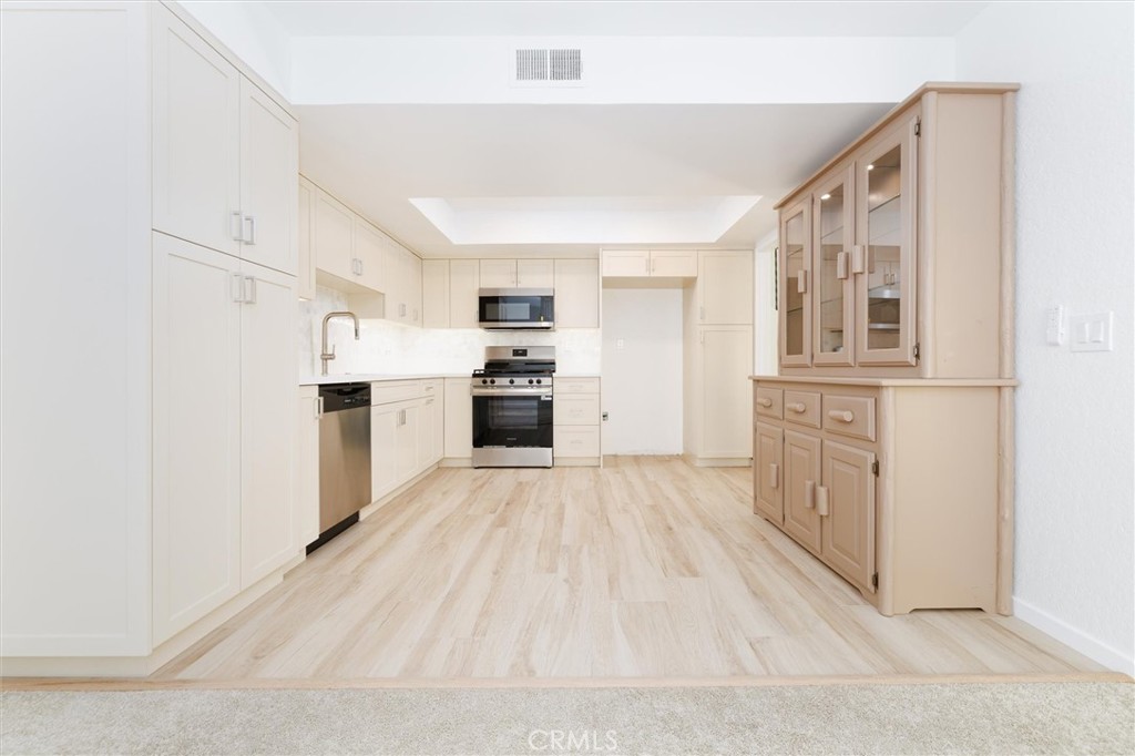 27139 Rio Prado Drive Valencia, CA 91354 - Photo 7 of 34 a view of a kitchen with electric appliances