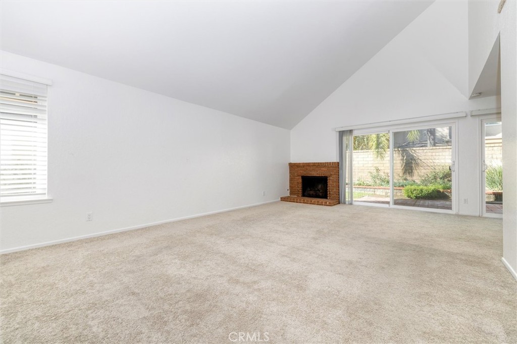 27139 Rio Prado Drive Valencia, CA 91354 - Photo 9 of 34 an empty room with fireplace