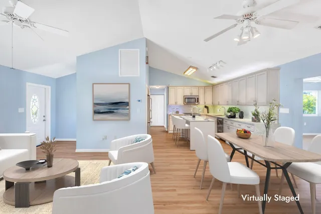 a kitchen with granite countertop a sink and cabinets