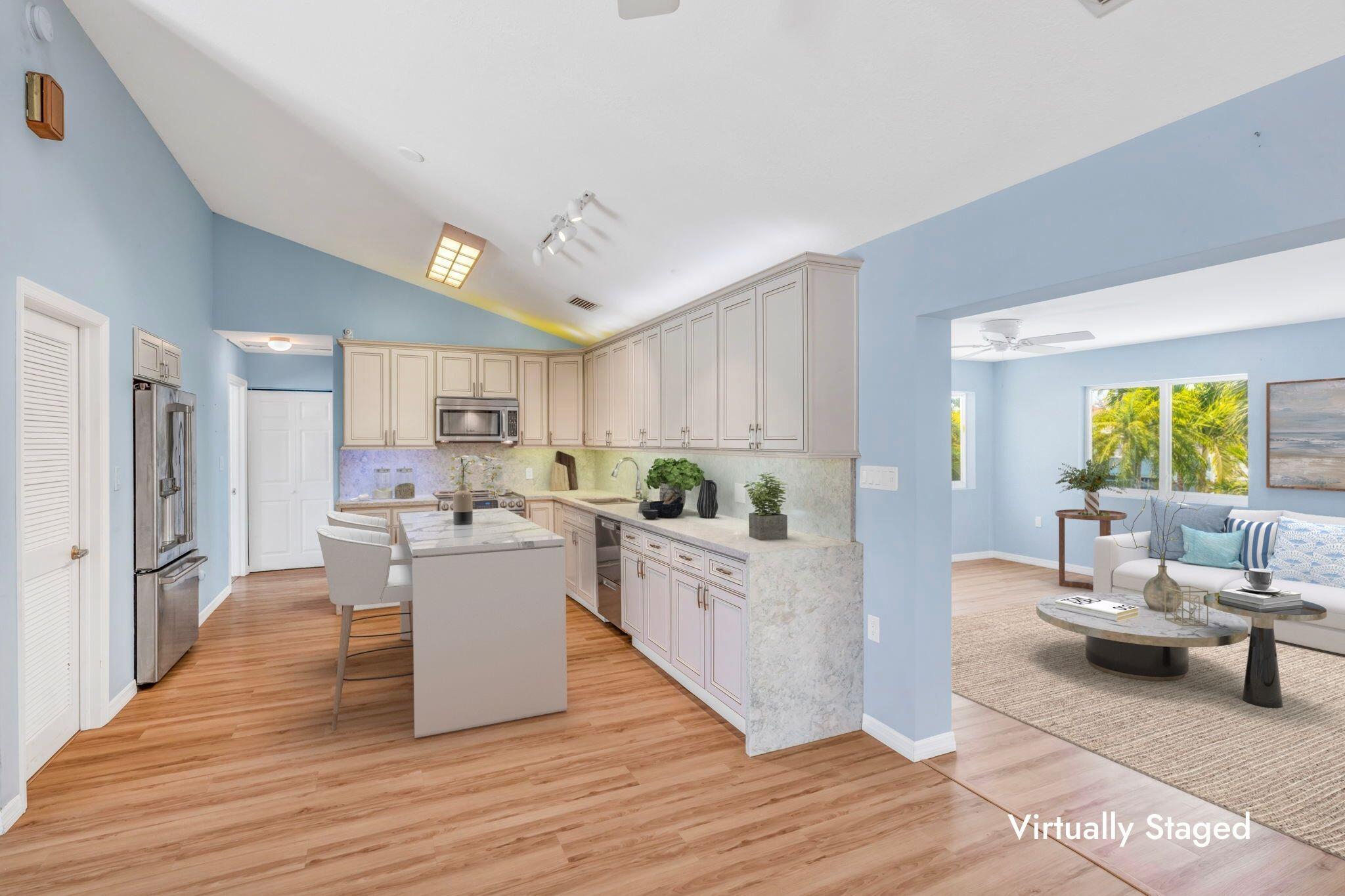501 11th Street Key Colony Beach, FL 33051 - Photo 17 of 52 a view of a living room kitchen and a wooden floor